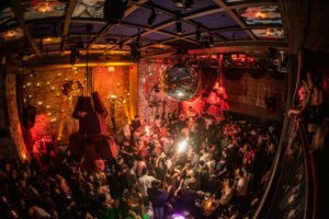 Energetic crowd on the dance floor at Musica nightclub in Hell's Kitchen, Midtown Manhattan