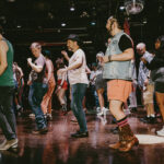 Line dancing class led by Terence Ng of DanceOut Atlanta at The Heretic bar in Atlanta