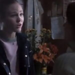 Julia Stiles as Sara in Save the Last Dance, wearing a pink sweater set and parka, representing her ballerina past.