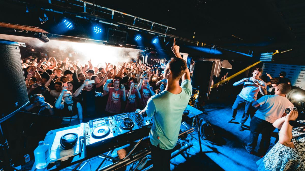 Energetic crowd enjoying a vibrant night at one of the top dance clubs in Sarasota, Florida.