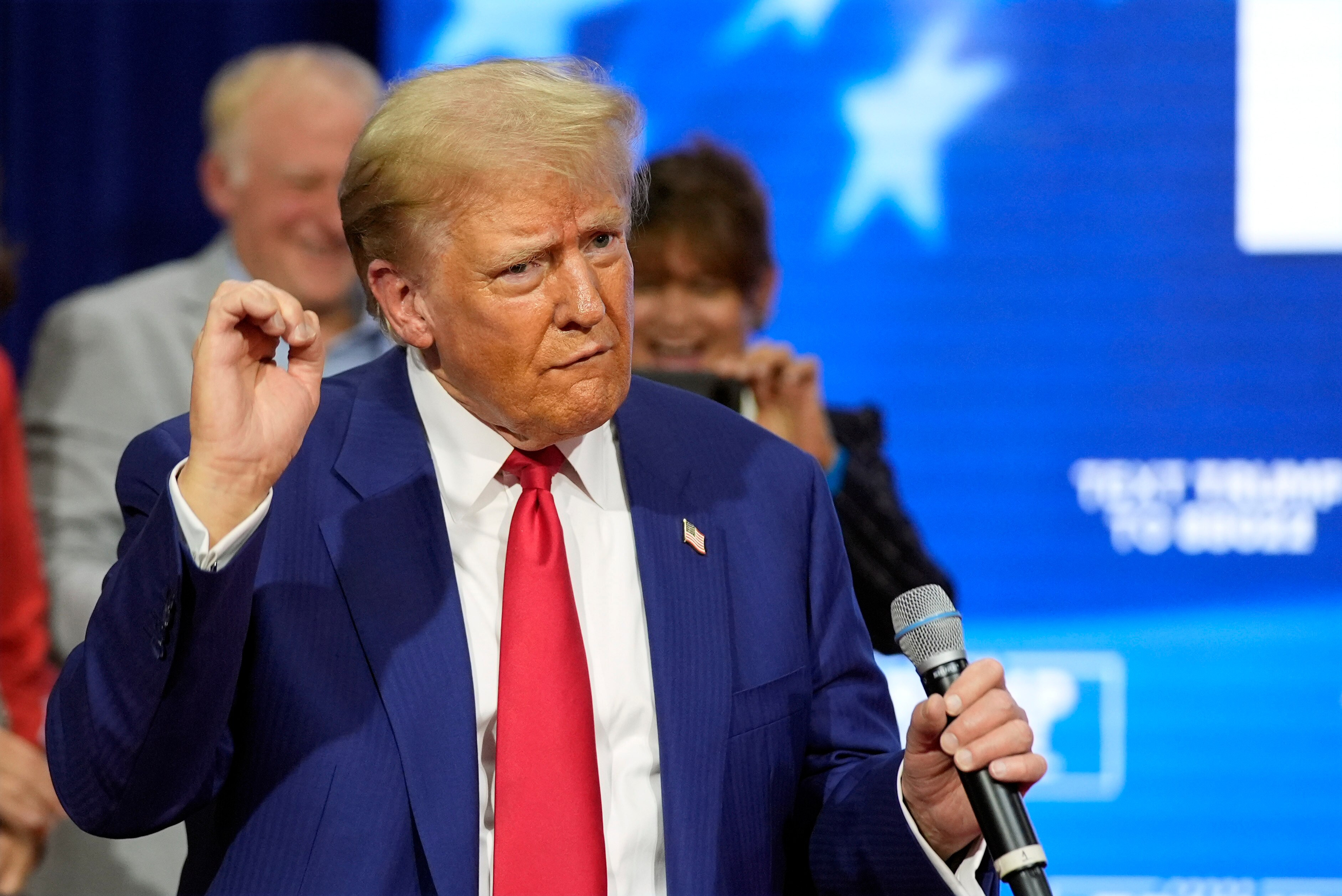 A close up of Donald Trump dancing at campaign event