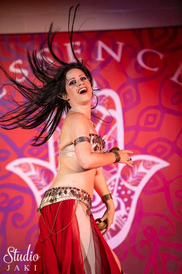 Belly dancer with beaded weft hair extensions