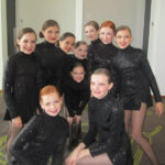Young dancers performing on stage at the Legacy Dance Championships, showcasing their talent and passion for dance.