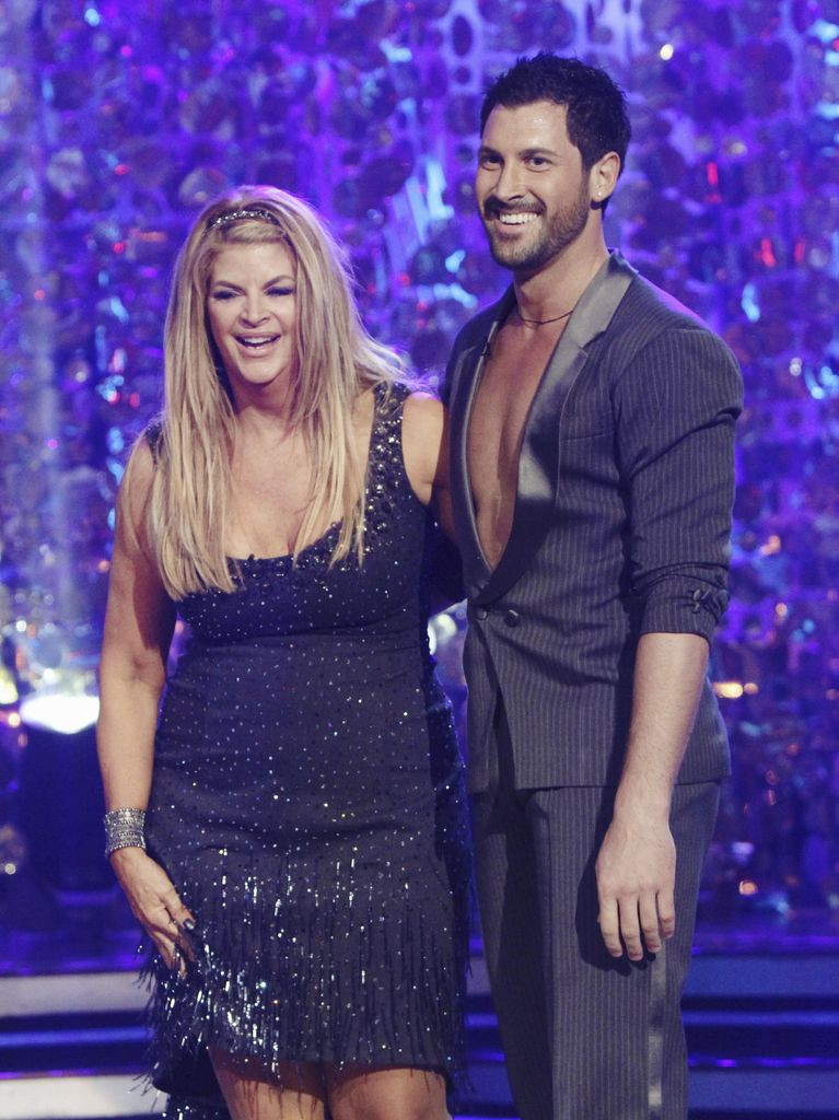 Kirstie Alley and Maksim Chmerkovskiy posing together on Dancing with the Stars
