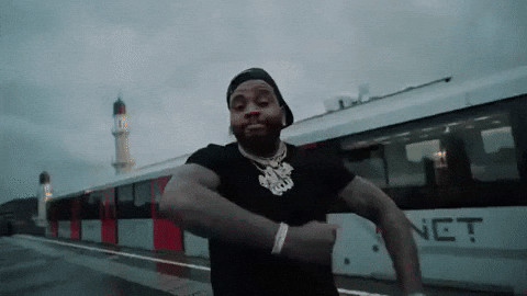 Kevin Gates confidently dancing and pointing at himself, originating from his RBS Intro music video, in a GIF format.