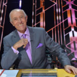 Len Goodman smiling at the judges' table on Dancing with the Stars