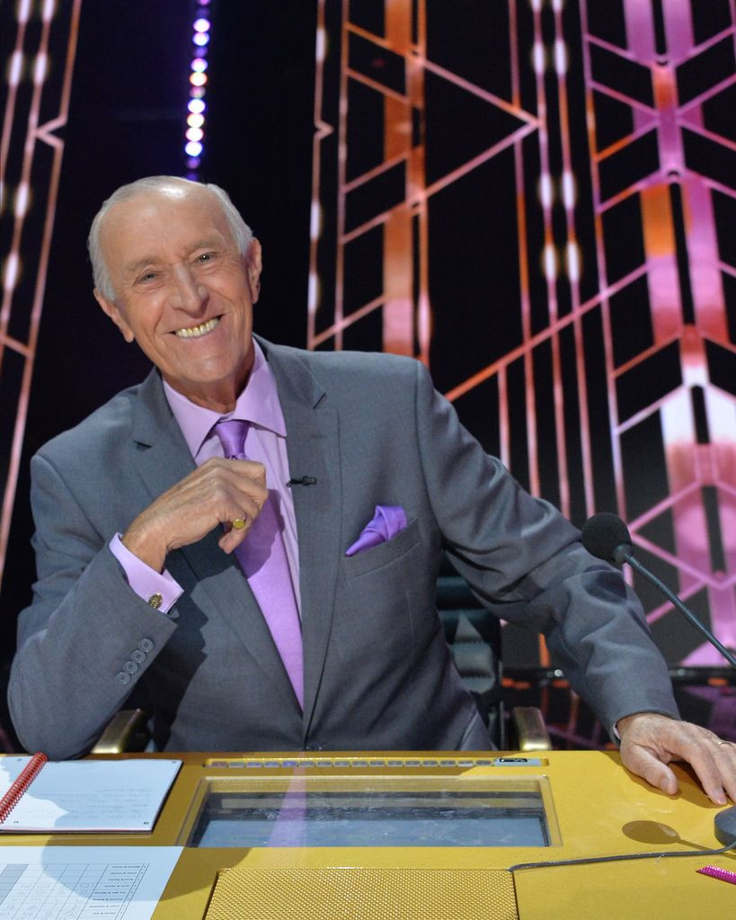 Len Goodman smiling at the judges' table on Dancing with the Stars