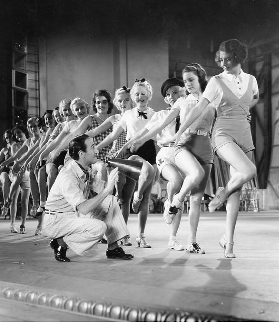 Scene from 42nd Street showcasing the bustling energy of the backstage world, highlighting the film's depiction of a vibrant 'dance street' environment within the theater.