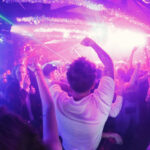 People dancing and enjoying music at Outer Heaven Disco Club in Austin