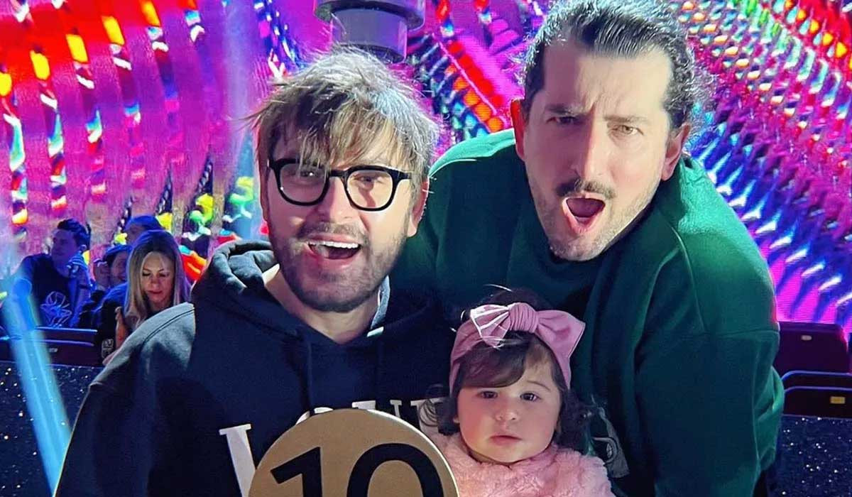 Brian Dowling, Arthur Gourounlian, and daughter Blake pose for a picture.