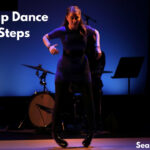 A young tap dancer in action, demonstrating a tap dance step.