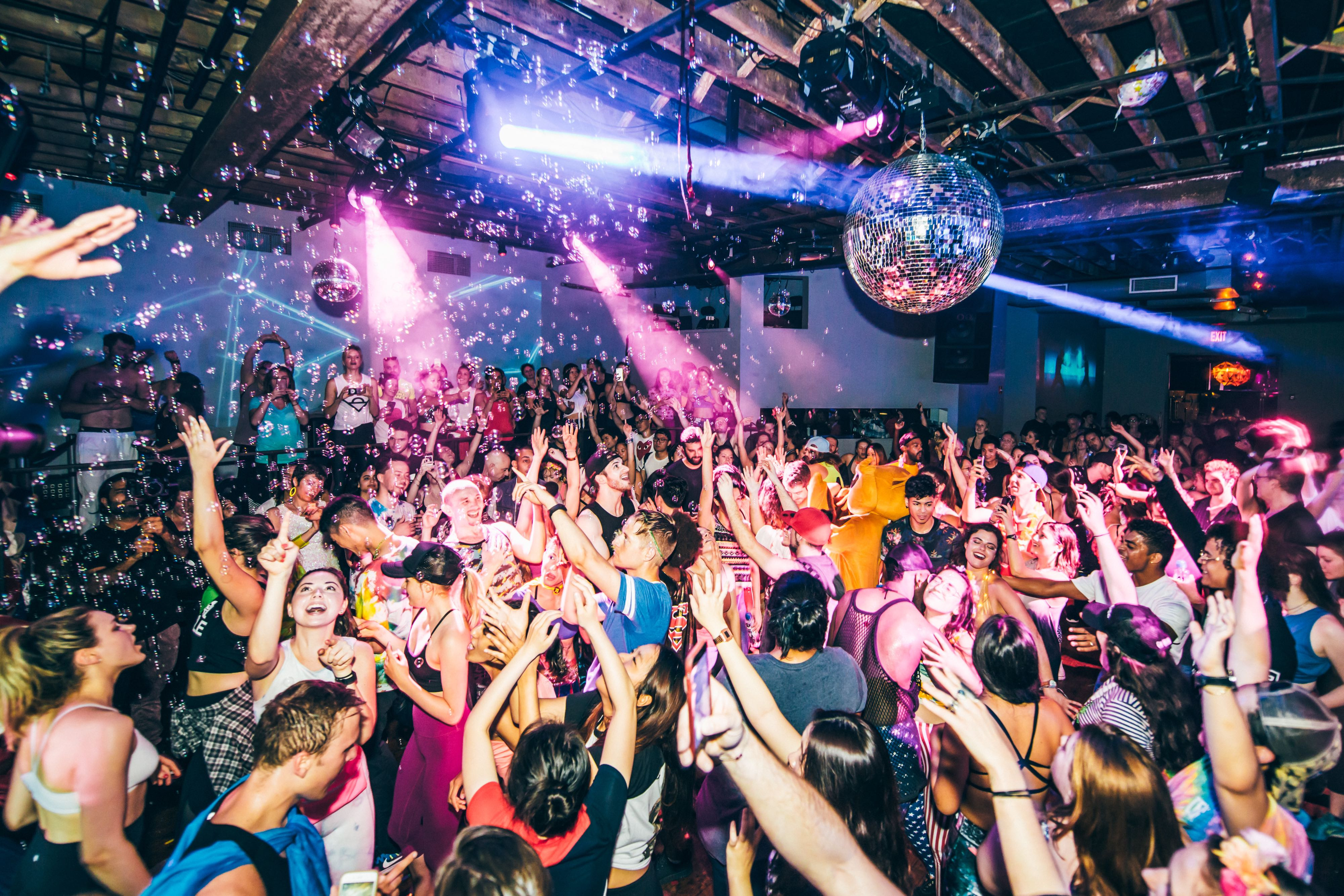 People participating in a Daybreaker morning dance party, an alternative dance event in Philadelphia.