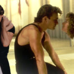 Jennifer Grey and Patrick Swayze in Dirty Dancing in an embrace and looking at each other