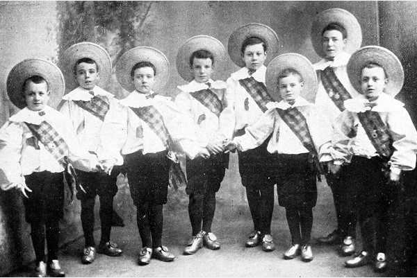 The Eight Lancashire Lads clog dancing troupe, featuring a young Charlie Chaplin (possibly in the center), showcasing early 20th-century clog dance performance.