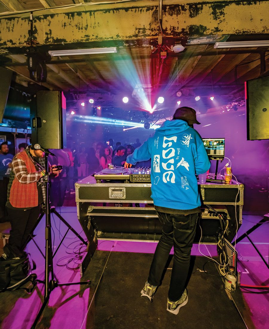 DJ performing at Warehouse on Watts, a popular venue for dance parties in Philadelphia.