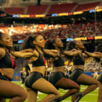 Majorette dancers from Grambling State University's Orchesis Dance Company perform a high-energy halftime routine.