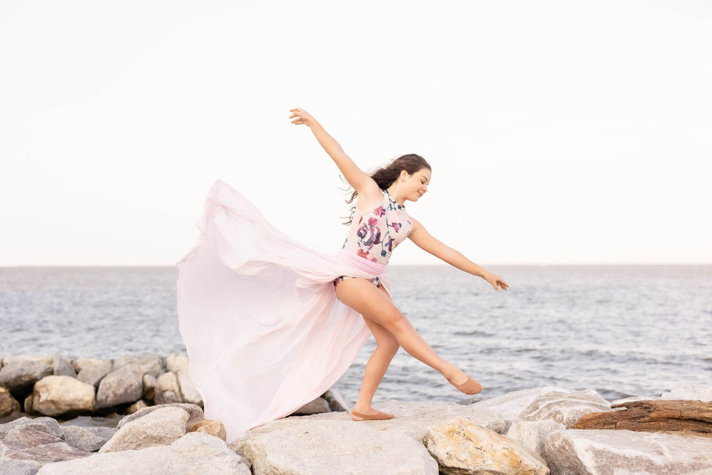 Studio dance photography with dramatic lighting and posing.
