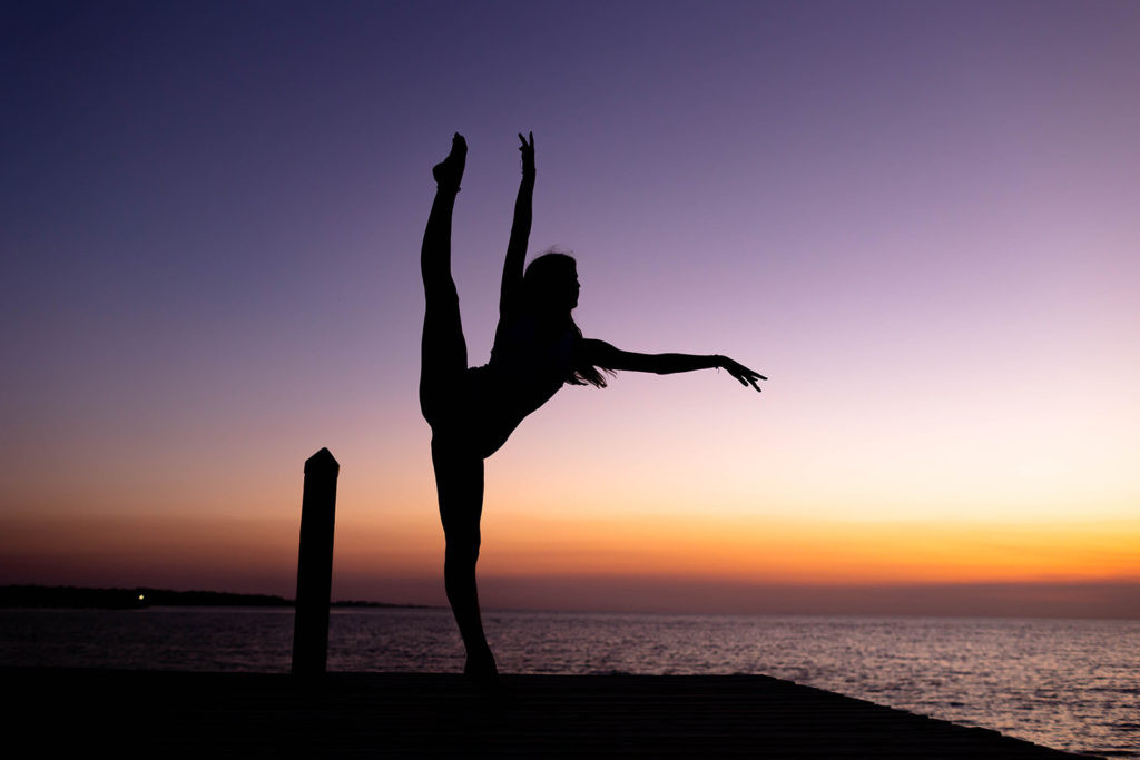 Creative dance photography using props to enhance the visual storytelling.