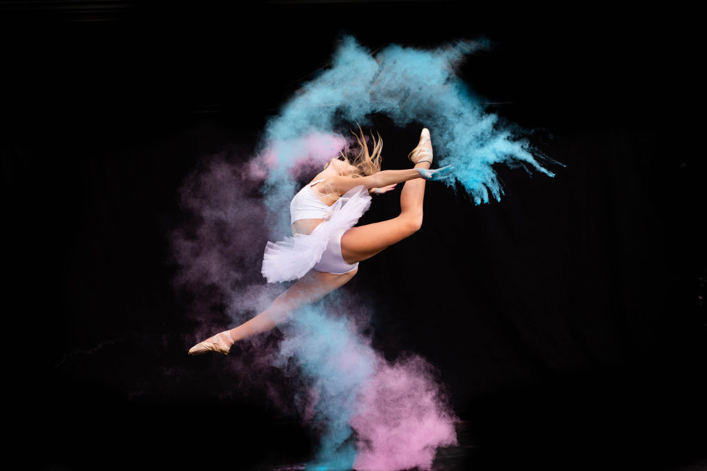 Stunning silhouette dance photography against a bright backdrop.