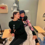 Kelly Hyland and her daughters, Brooke and Paige, known from Dance Moms, demonstrating a close family bond.