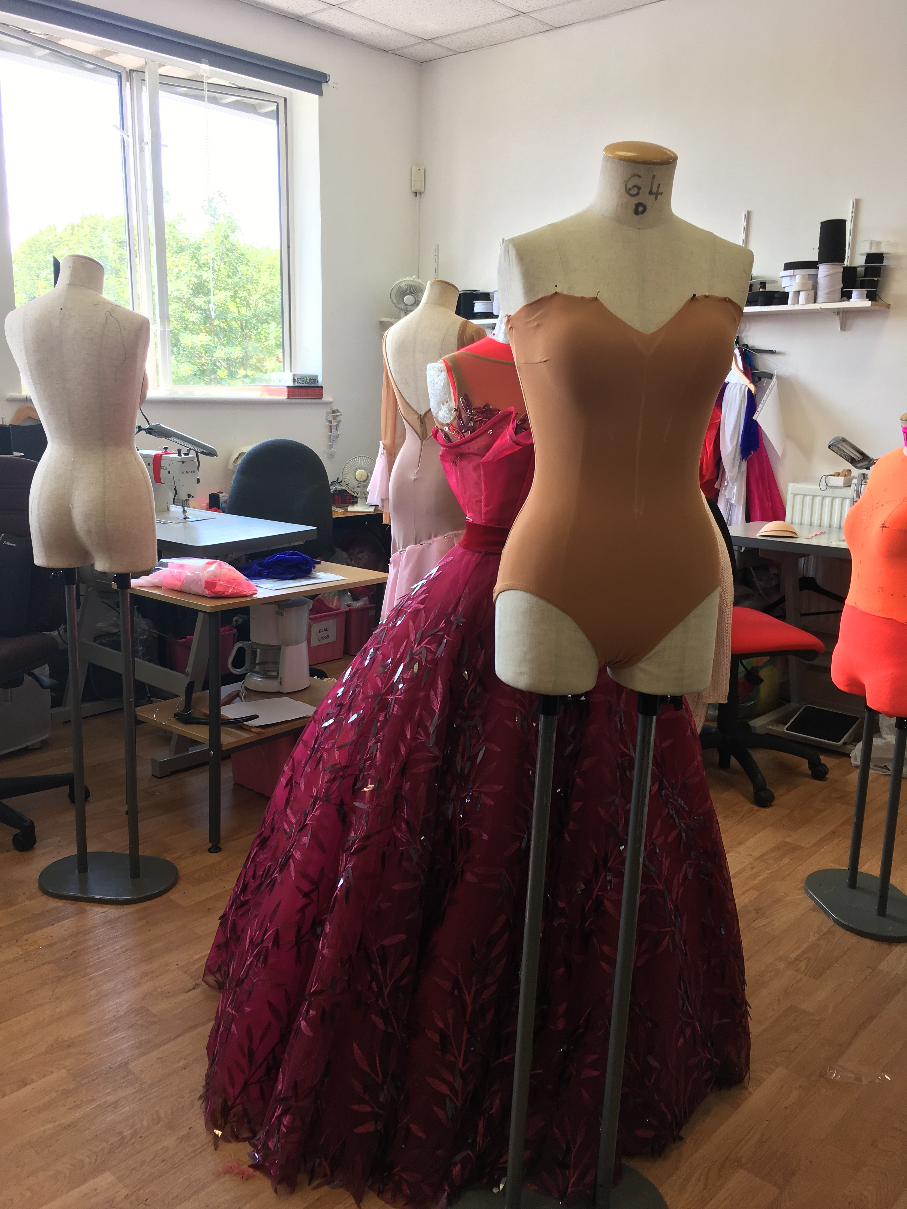 Another view of a dance costume fitting, showing the collaborative process and attention to detail in ensuring a perfect fit for the dancer.
