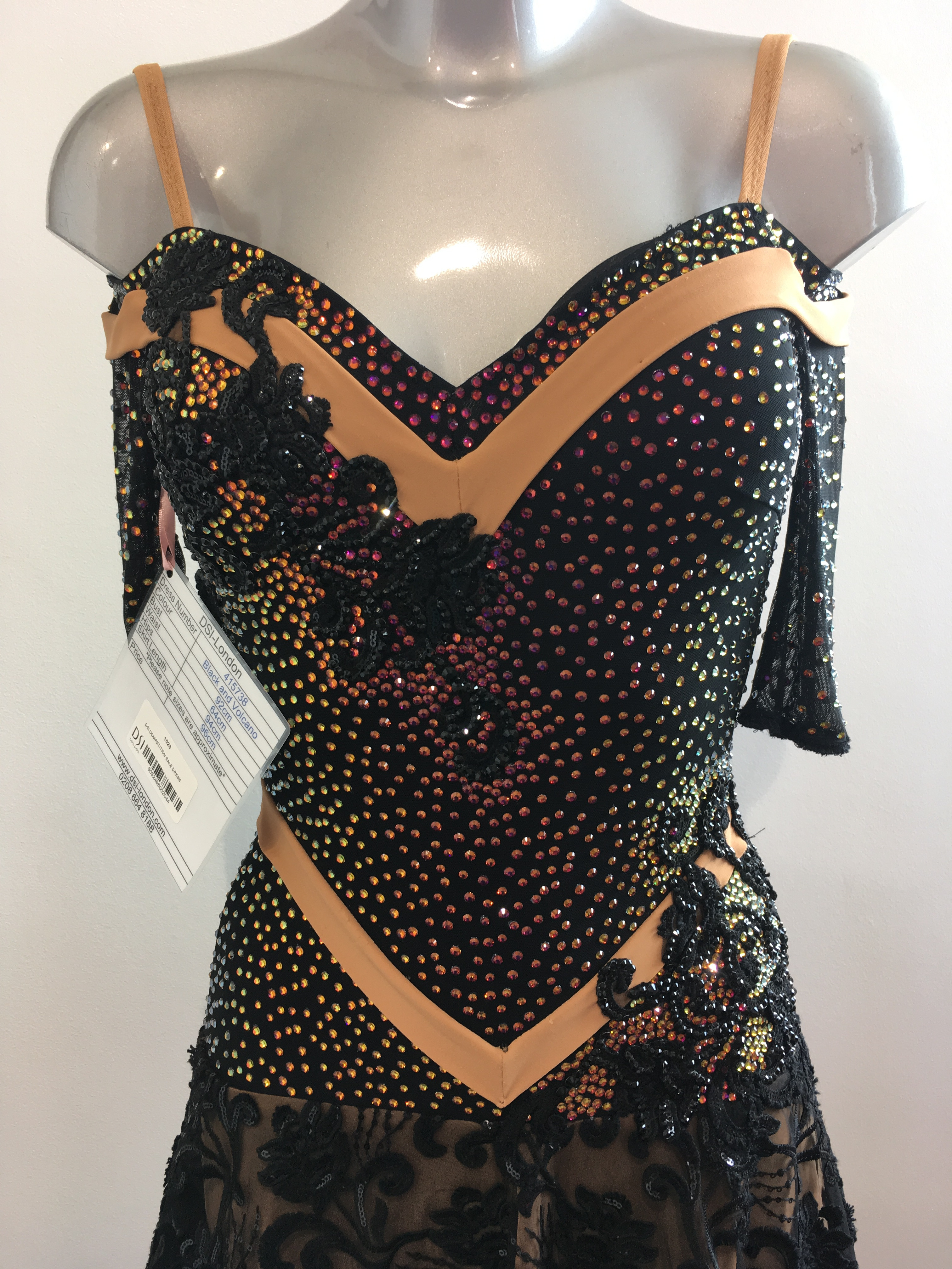 The beautiful color palette of stones on a dance costume bodice, highlighting the artistry in color selection and arrangement for visual impact.