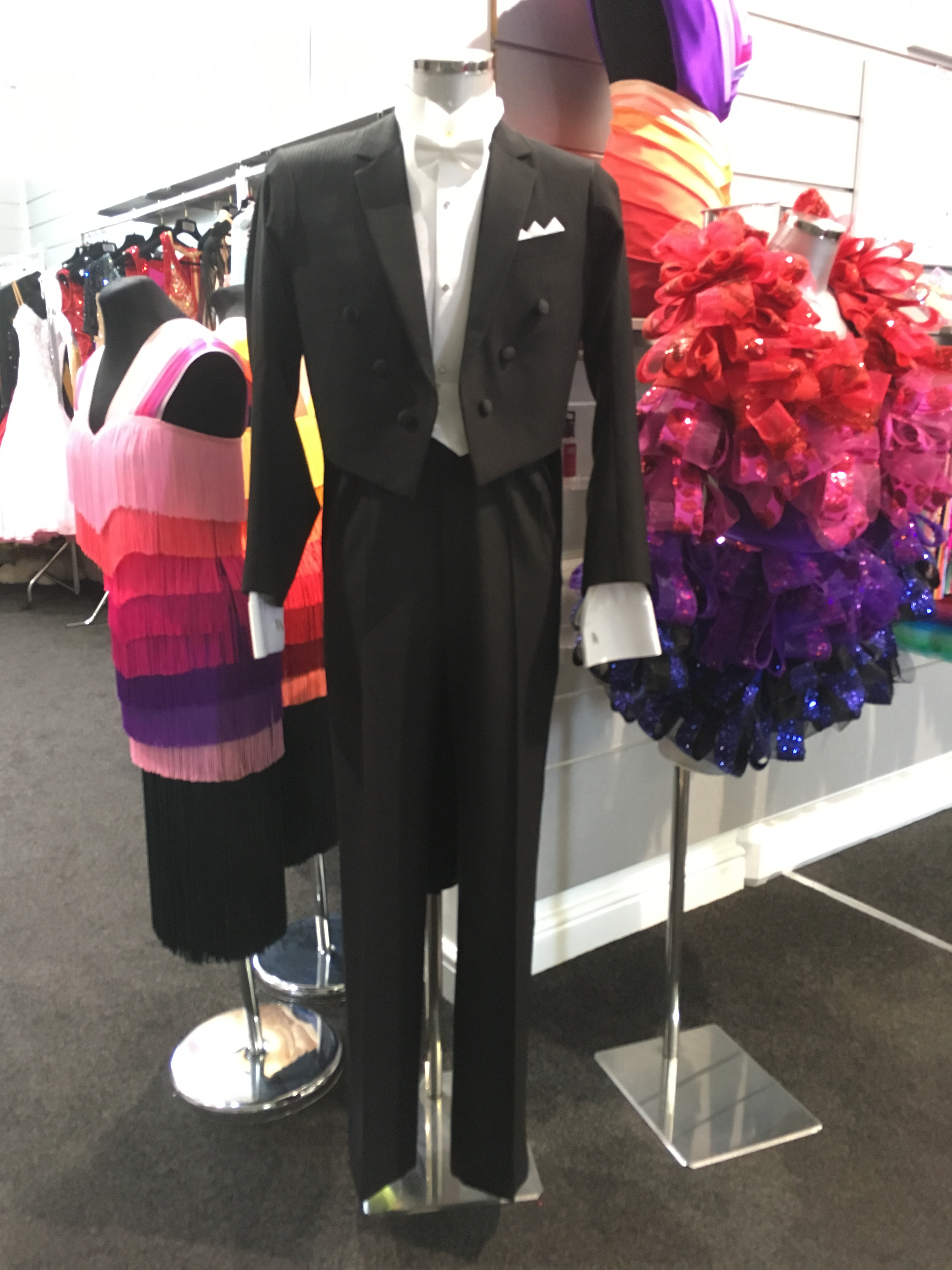 A sophisticated men’s ballroom dance outfit, demonstrating the tailored elegance and specific design considerations for male dancers' attire.