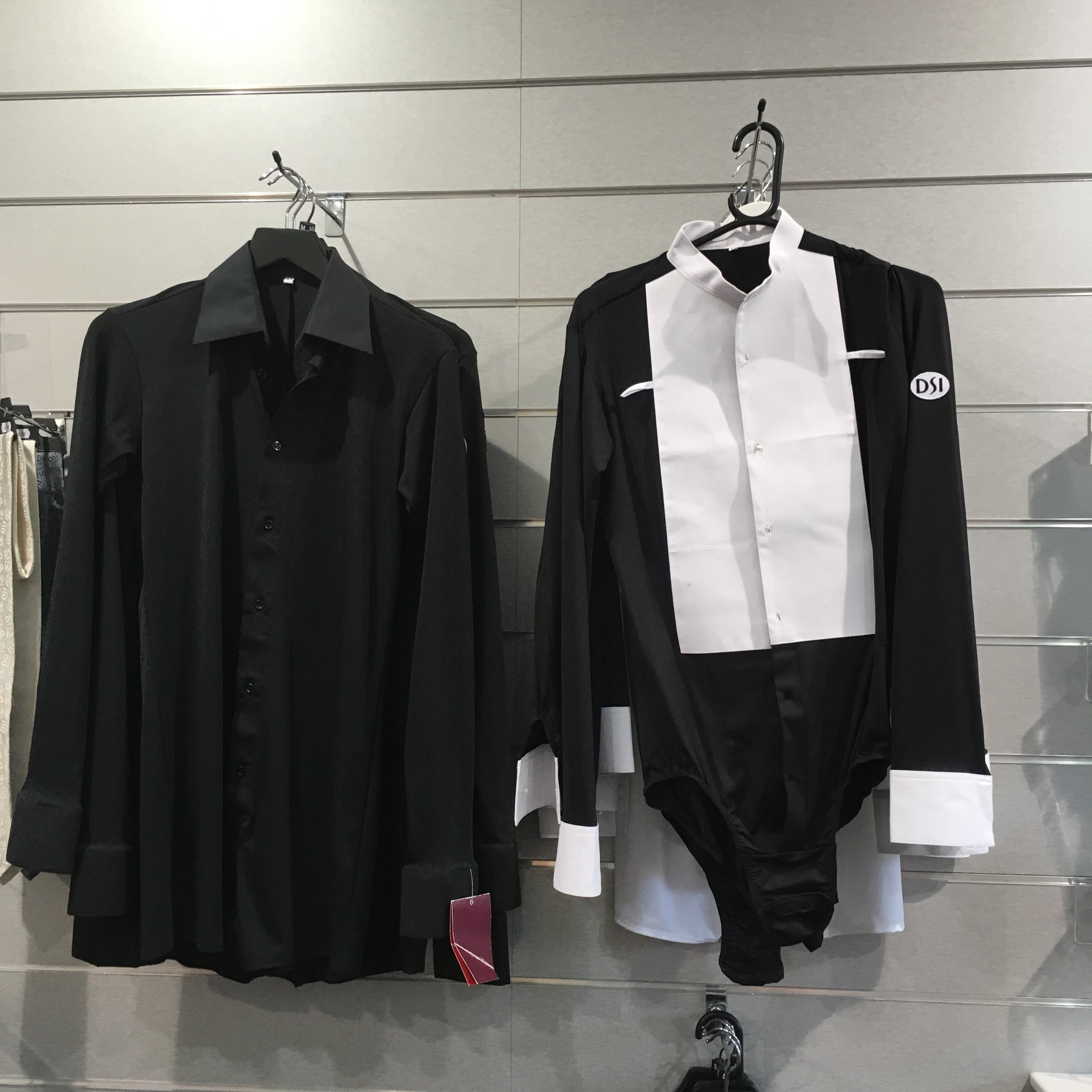 A specialized 'body' garment, designed to ensure a seamless and tucked-in shirt look for male ballroom dancers, a practical element of dancewear.