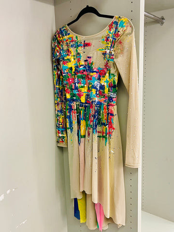 Rhinestones and viridian color accents added to a painted dance costume for enhanced visual appeal.