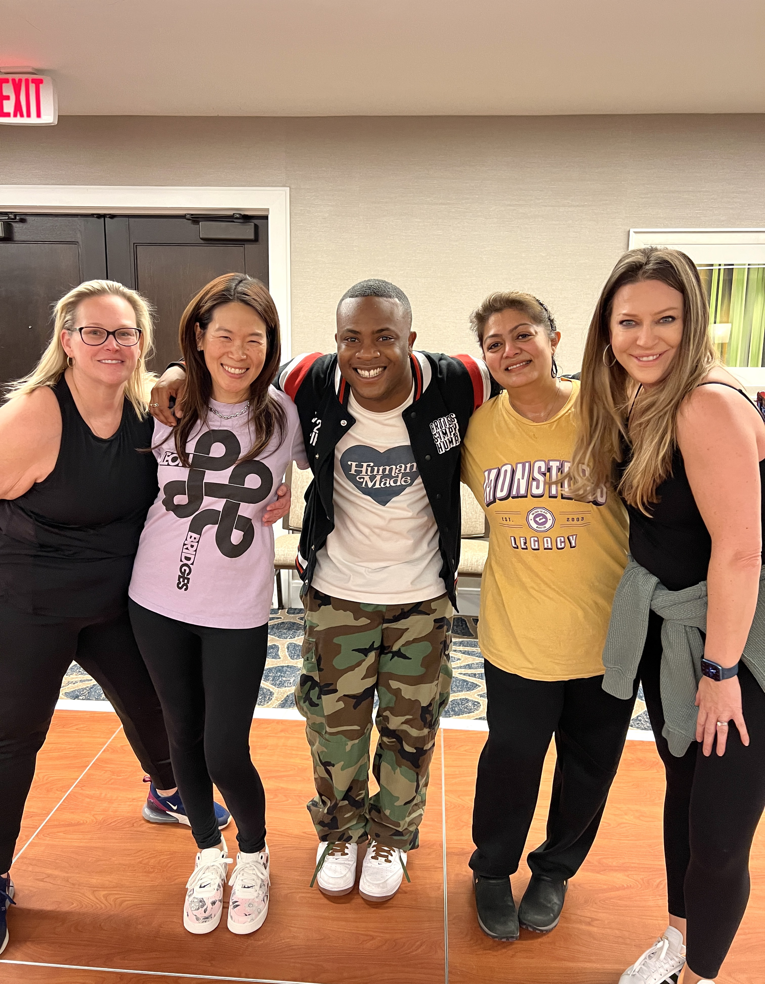 Moms participating in Matthew Smith's energetic Hip Hop class at the ASH Dance Convention, enjoying the fun and fitness.