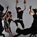 Dancers in a studio setting, practicing safe dance techniques