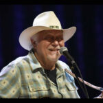 Jerry Jeff Walker performing at Nashville Boogie, highlighting his long-standing influence on venues like Luckenbach Dance Hall.