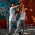Experience the fluidity and connection of Brazilian Zouk dance as a couple performs a graceful move.