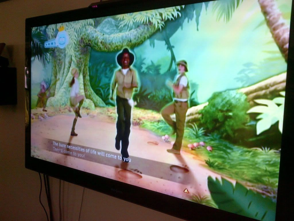 Mowgli and Baloo dancing to The Bare Necessities in Just Dance Disney Party, simple pleasures and carefree attitude