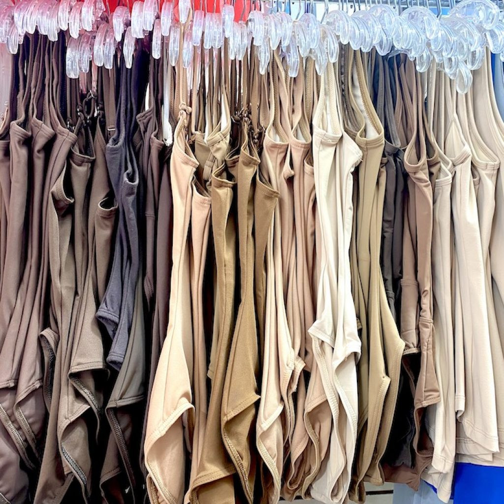 A vibrant display of leotards in various styles and colors at On Stage Dancewear.