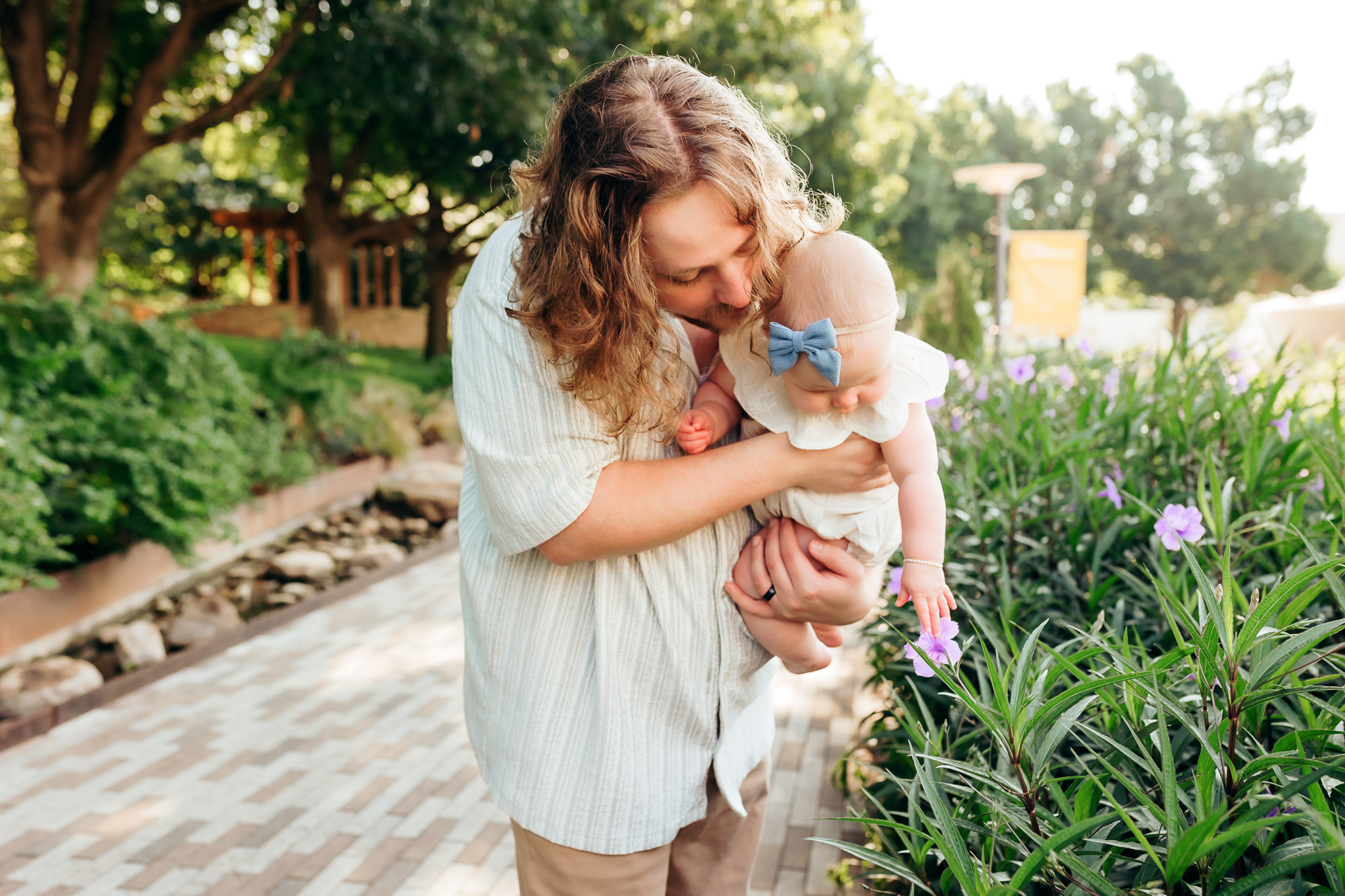 A father and daughter bonding over nature, representing the family connection fostered through parent-child classes.