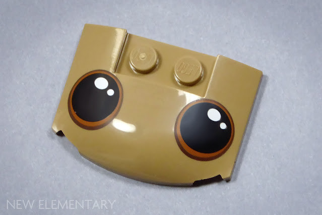 Close-up of the custom printed curved LEGO slope piece with large, adorable eyes, designed for the Dancing Groot LEGO set.