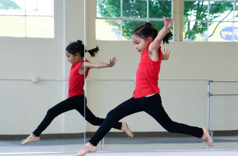 Young children participating in a creative movement dance class, showing the joy of early dance education