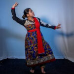 Kathak dancer in a poised stance, showcasing the elegance of Indian classical dance.