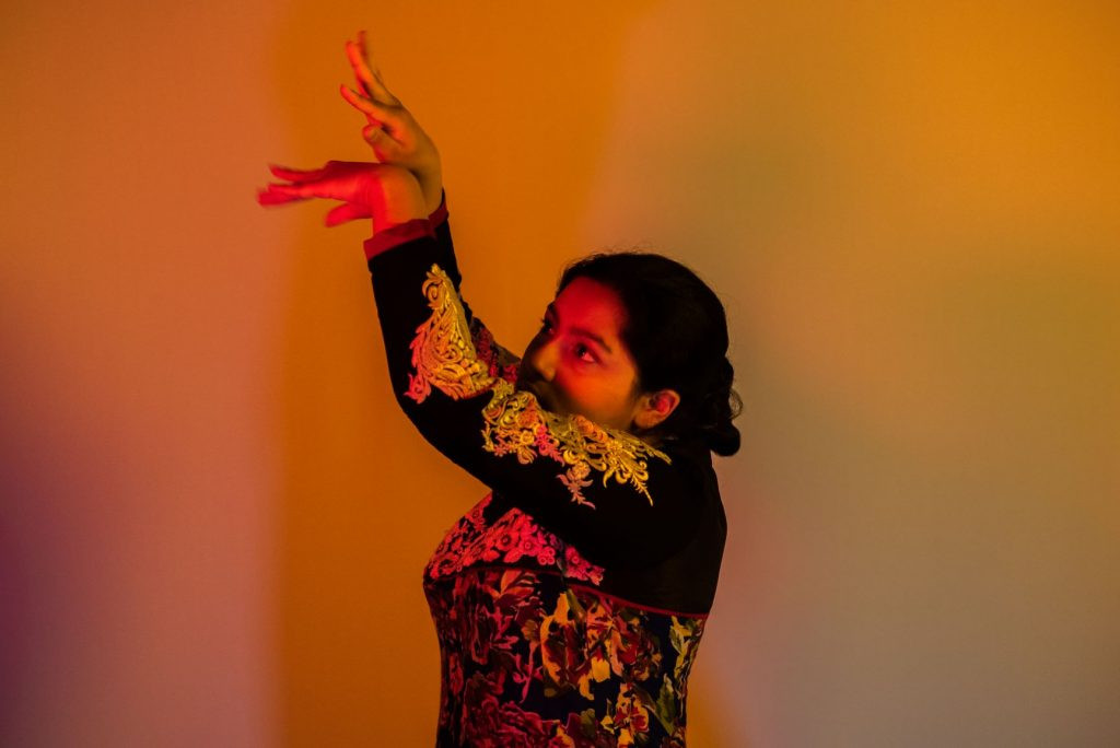 Ghunghru anklets on a Kathak dancer's feet, highlighting the rhythmic footwork and musicality of Indian dance.