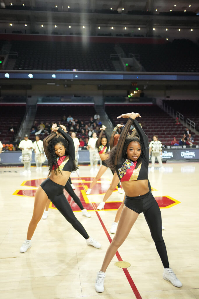 The USC Cardinal Divas demonstrate majorette dance style, expanding its reach beyond historically Black colleges and universities.