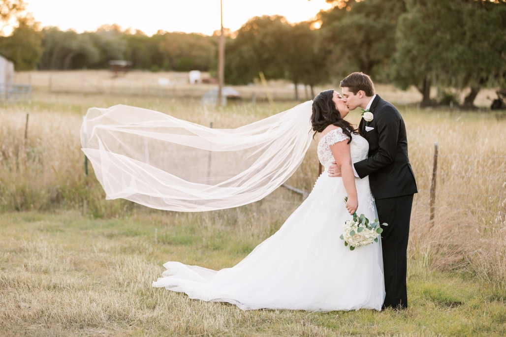 Couple's first dance at their autumn wedding at Fischer Dance Hall in Fischer, TX