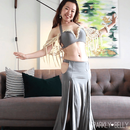 Hip scarf draped as sleeves with ends tucked at the bra straps
