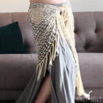 Regular hip scarf around hips and tied in the front showcasing traditional belly dance style