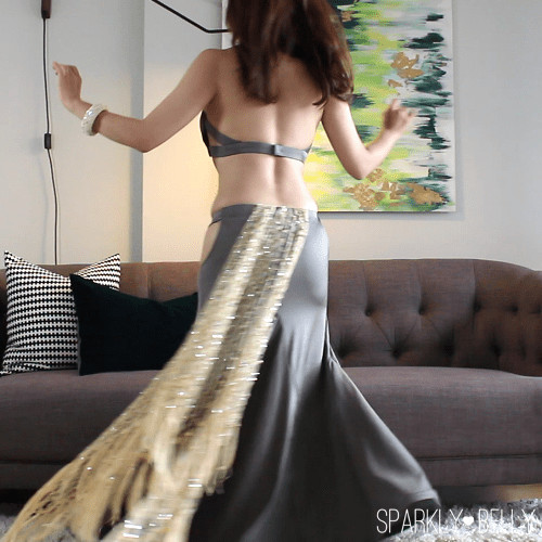 Hip scarf styled as a tail tucked at the back waistband