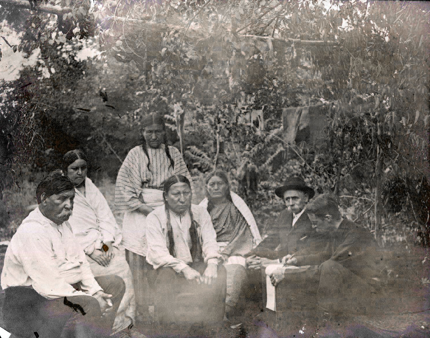 Alfred White listening to the story of the Ghost Dance at the Seger Colony, 1901
