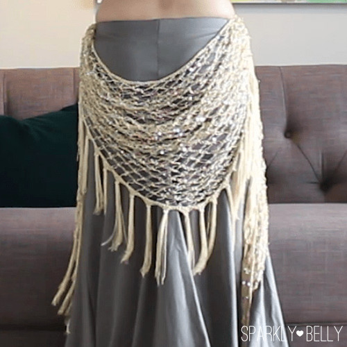 Back drape hip scarf tucked at the sides of the skirt waistband