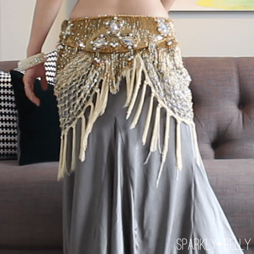 Side drape hip scarf with a belt worn over for a stylish enhancement