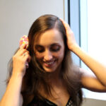 Brushing hair before styling for a secure french twist