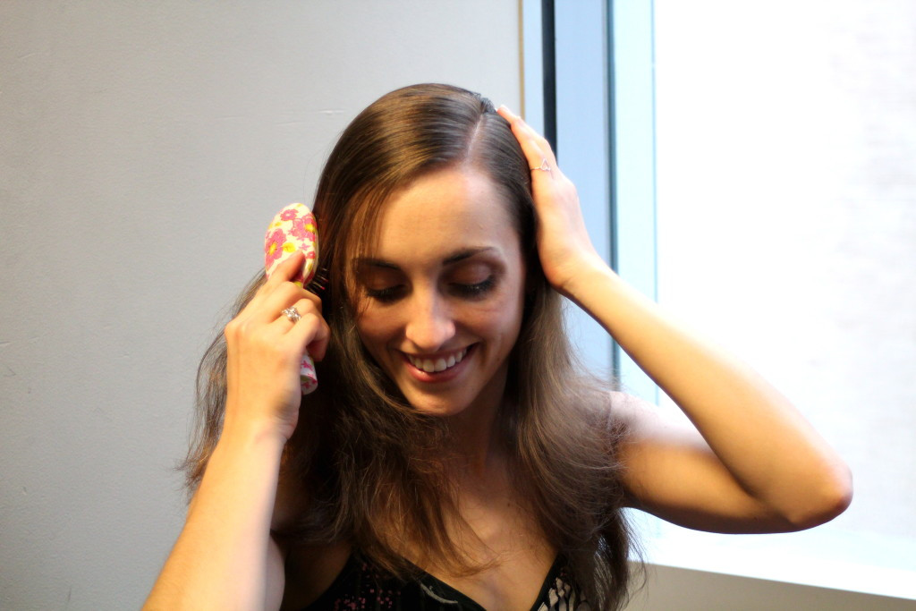 Brushing hair before styling for a secure french twist